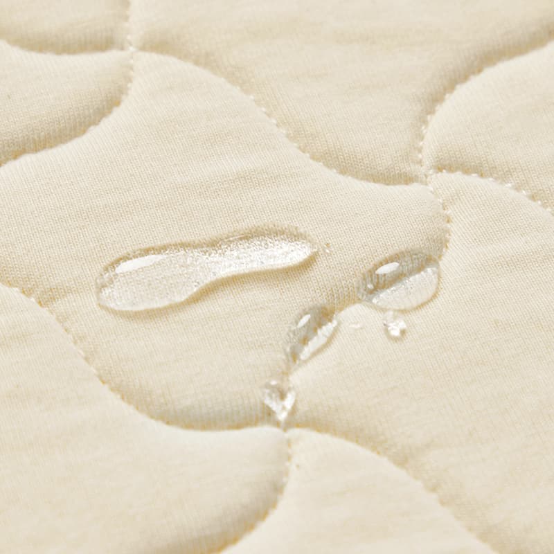 Matelas à langer profilé avec housse en coton biologique, doublure intérieure imperméable et sangle de sécurité | Beige | Unique